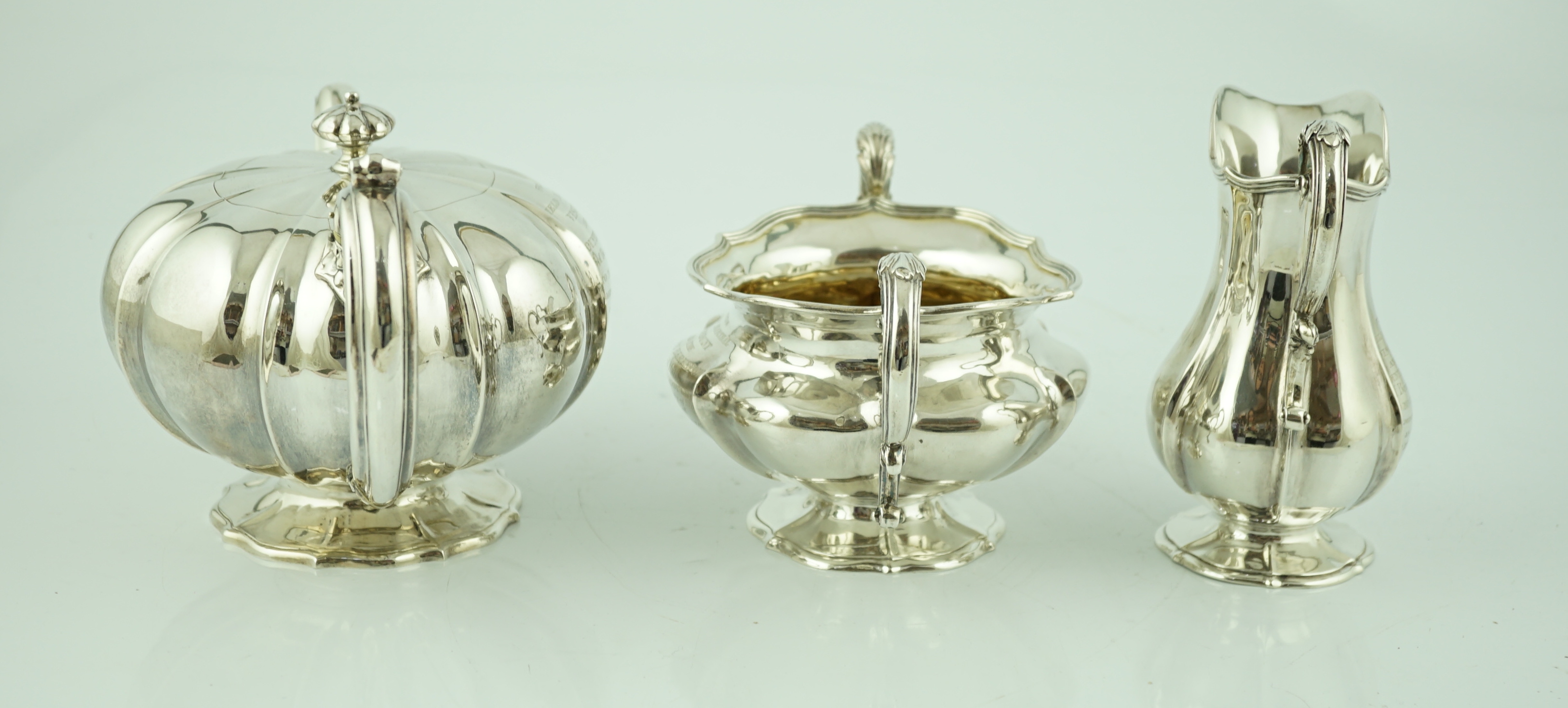 A matched three piece William IV and Victorian silver tea service, the teapot inscribed to 'Field Marshall Viscount Beresford, Beresford Hall 1849'